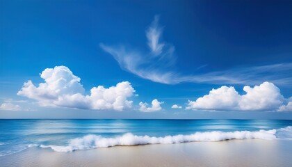 Obraz premium a vibrant blue sky adorned with fluffy white clouds gently drifting and casting soft shadows creating a serene and tranquil atmosphere