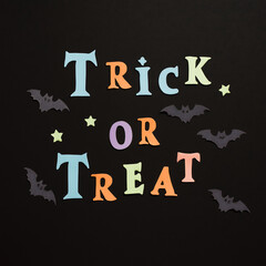 trick or treat words orange on black background halloween

