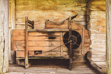 old wooden thresher for threshing grain