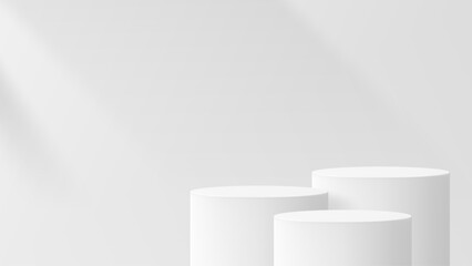 Obraz premium Empty white cylinder podiums with light shadow on clean wall. Minimal display stage for product presentation. Modern display base mockup.
