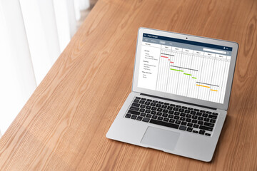 Project planning software for modish business project management on the computer screen showing...