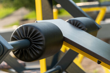 Brightly lit outdoor gym features sturdy workout equipment ready for use in a community park during...