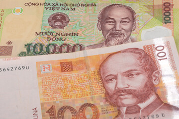10000 Vietnamese dong and 100 Croatian kuna banknotes. International trade concept