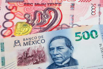 5000 Kazakhstani tenge and 500 Mexican peso banknotes. International trade concept