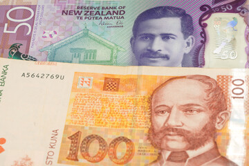 50 New Zealand dollar and 100 Croatian kuna banknotes. International trade concept
