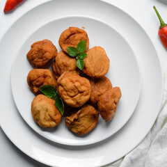 Overhead view of Akara on a white plate, top view of nigerian akara fried beans cake on a plate