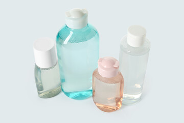 Bottles of micellar water on white background