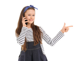 Little girl talking by mobile phone on white background
