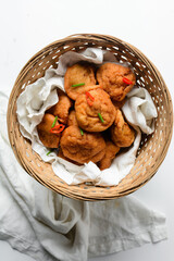 Overhead view of Akara in a basket, top view of nigerian akara fried beans cake	