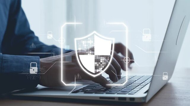 Business professional interacting with digital security icon on laptop, emphasizing the importance of data protection and cyber safety in today tech-driven work environment. Qubit