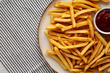 Homemade Golden French Fries with Ketchup, top view. Copy space.