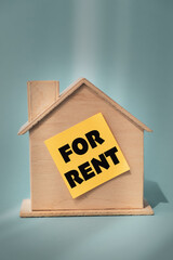 Miniature real estate house with for rent label
