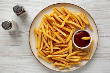 Homemade Golden French Fries with Ketchup, top view.