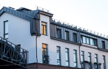 A building with a balcony and a roof