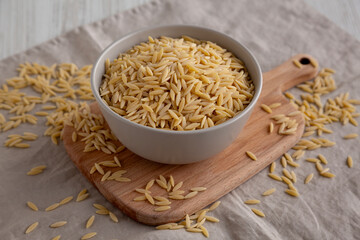 Organic Dried Orzo Pasta in a Bowl, side view.