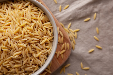 Organic Dried Orzo Pasta in a Bowl, top view.