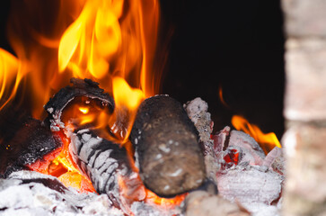 Lighting the fire for a barbecue with wood and charcoal. 