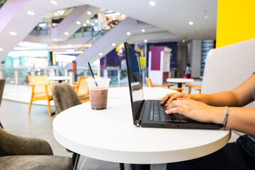Digital nomad cafe, remote worker with laptop in cafe