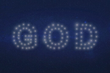 The word GOD shines in clustered white lights against a cosmic black backdrop. Each letter stands distinct yet ethereal, as if written by the stars themselves. Dramatic space illustration.