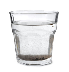Glass with dirty water isolated on white