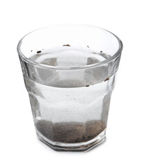 Glass with dirty water isolated on white