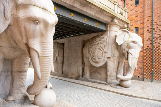 The Elephant Gate features striking stone sculptures of elephants that welcome visitors to the brewery in Copenhagen, Denmark. This architectural marvel blends art and history beautifully.