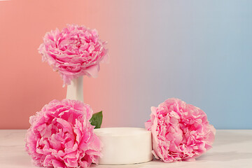 Creative template for your design.Empty podium with beautiful peony flowers for product display.Abstract flower arrangement,banner.Minimal modern aesthetic,elegant beauty concept