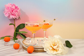 Ice punch with apricots, Modern still life with summer alcoholic cocktail and peonies on modern...