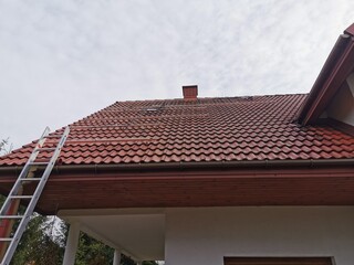 The structure on the house's tiled roof for installing solar panels, with microinverters also installed