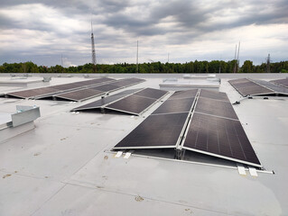 Close-up of a solar panel surface covered with fresh rain droplets. Clean energy and weather...