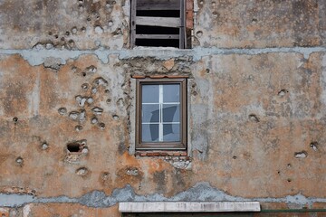 Damaged wall bullet hole after war