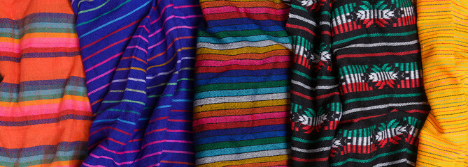 Colorful typical mexican tablecloths. Textile background, texture.