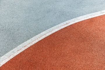 Curved line and contrasting colors create an abstract view of sports track