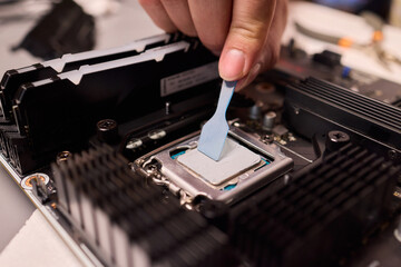 Carefully applying thermal paste on the CPU is essential for achieving optimal cooling performance