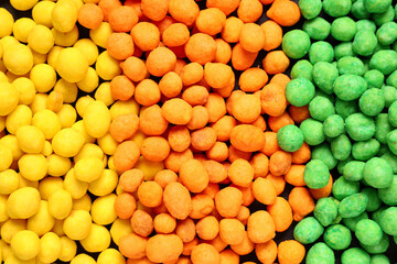 Colorful coated crunchy peanuts as background