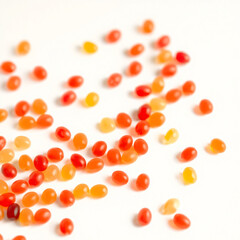 orange pills on white background