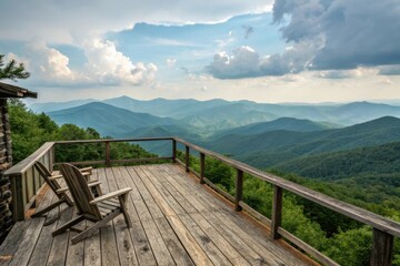 Wooden deck chairs overlooking hazy blue mountain ranges railing mountains