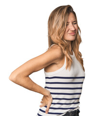 Caucasian blonde woman in studio suffering a back pain.