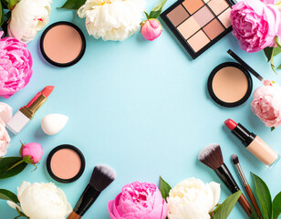 Pastel Makeup and Peonies on Blue Background