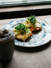 A plate of food with a side of coffee