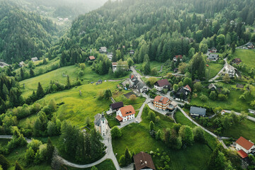 Calm idyllic village in Slovenian mountains at sunrise, summer travel concept