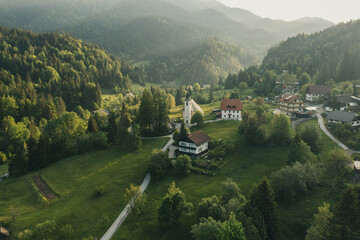 Calm idyllic village in Slovenian mountains at sunrise, summer travel concept