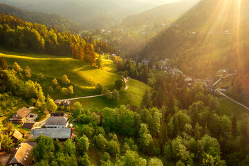 Calm idyllic village in Slovenian mountains at sunrise, summer travel concept