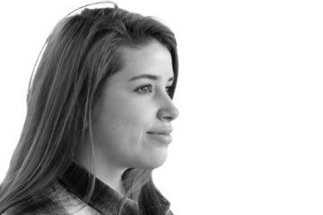 Close up portrait of beautiful young woman with dyed red hair and nose piercings.