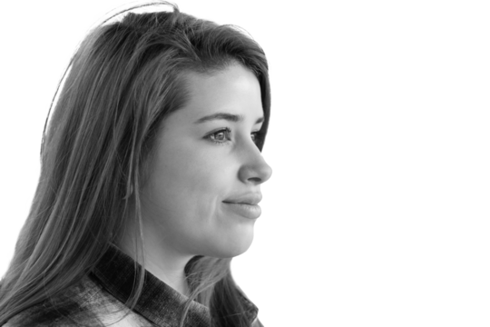 Close up portrait of beautiful young woman with dyed red hair and nose piercings.