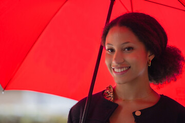 young latina woman with red umbrella