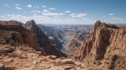 Panoramic vista of the Grand Canyon's dramatic rock formations and Colorado River