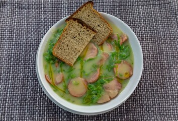 Traditional winter soup known as Portuguese green broth prepared good potatoes, kale and sausage. The best Portuguese broth in the world