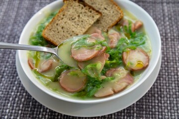 Traditional winter soup known as Portuguese green broth prepared good potatoes, kale and sausage. The best Portuguese broth in the world