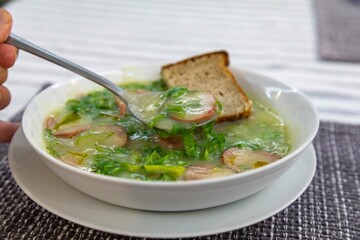 Traditional winter soup known as Portuguese green broth prepared good potatoes, kale and sausage. The best Portuguese broth in the world